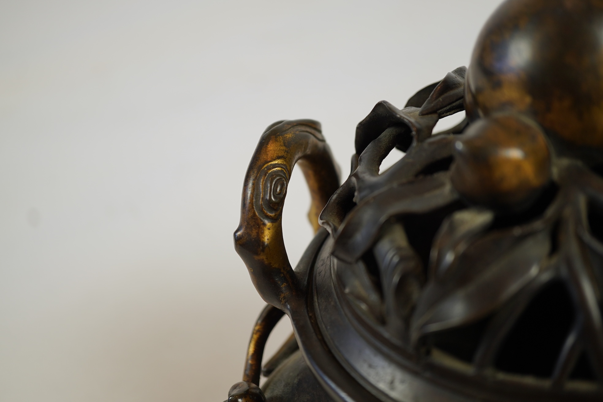 A large Chinese bronze and parcel gilt ‘peach’ censer and cover, Li, 17th/18th century